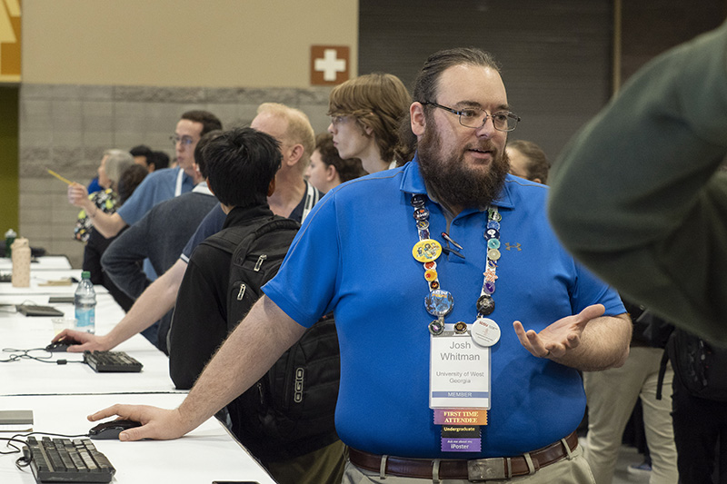 UWG physics student Josh Whitman presenting his research