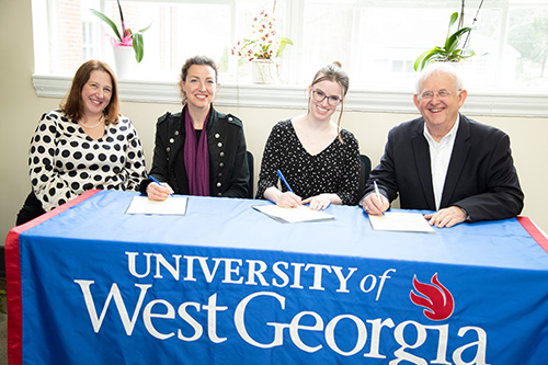 Pictured from left to right: UWG Ingram Library Dean Andrea Stanfield, UWG Head of Special Collections & Associate Professor Blynne Olivieri, Newnan-Coweta Historical Society Director Emily Kimbell, Newnan-Coweta Historical Society Board President Gary Welden