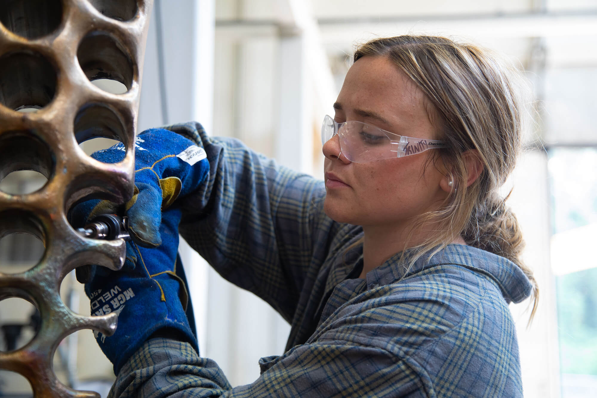 Trinity Dendy works on her sculpture "What It Isn't" at the Visual Arts Building on Carrollton's campus.