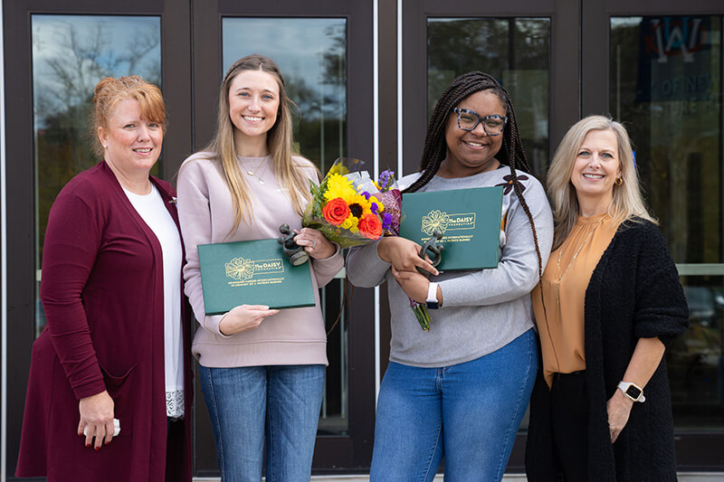 Emily Powell (left) and Dejah Shipman (right) receive their DAISY Awards.