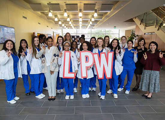 Group of UWG nursing students holding the letters LPW