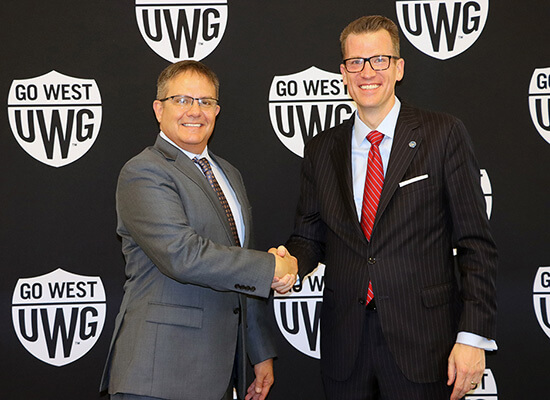 L to R: Dr. Mike Hobbs, GHC president; Dr. Brendan Kelly, UWG president