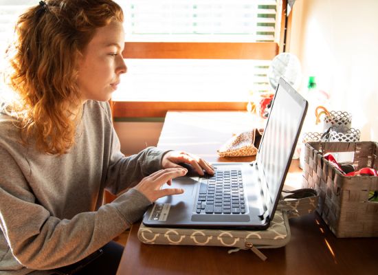 UWG online student on a laptop