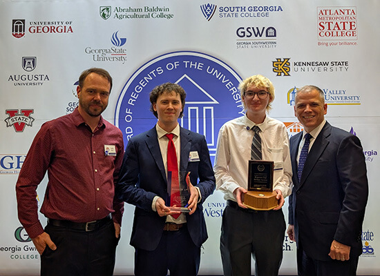 L to R: Justin Kirk, UWG Debate director; Bruce Bissell, UWG Debate; James Kennon, UWG Debate; Dr. Michael Johnson, UWG president