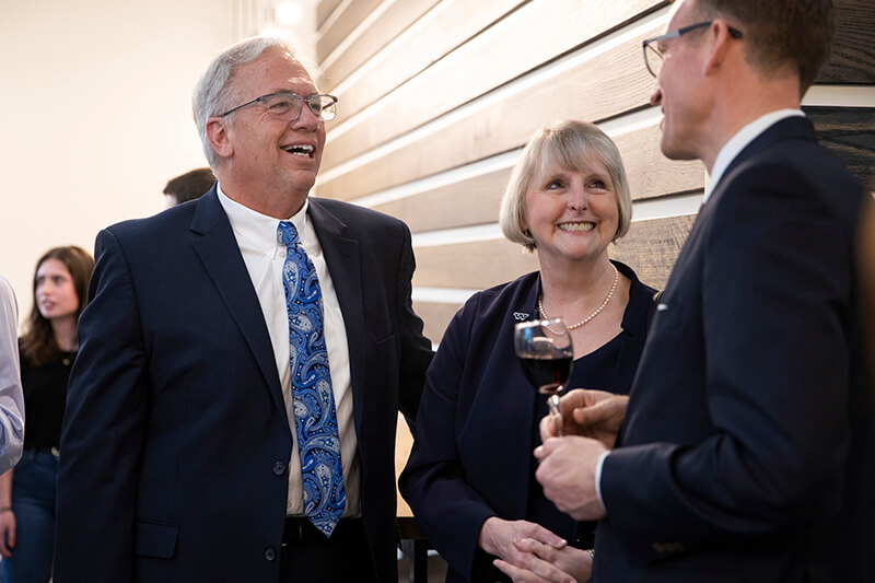 (L to R) Dr. Randy Richardson and Dr. Kathy Richardson speak with Dr. Brendan Kelly