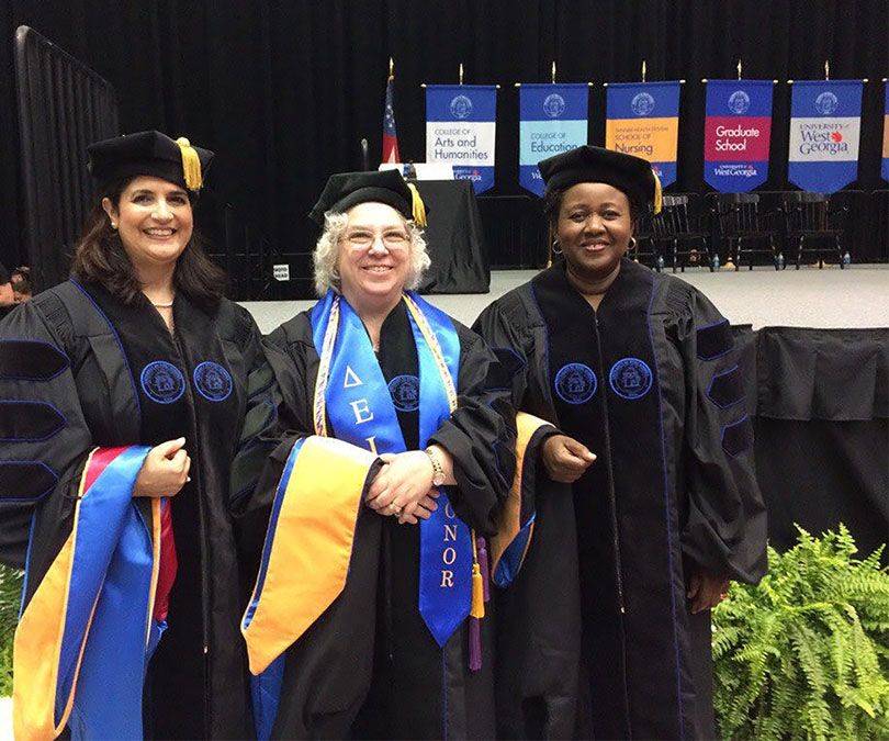 Doctoral graduate group photo at commencement.