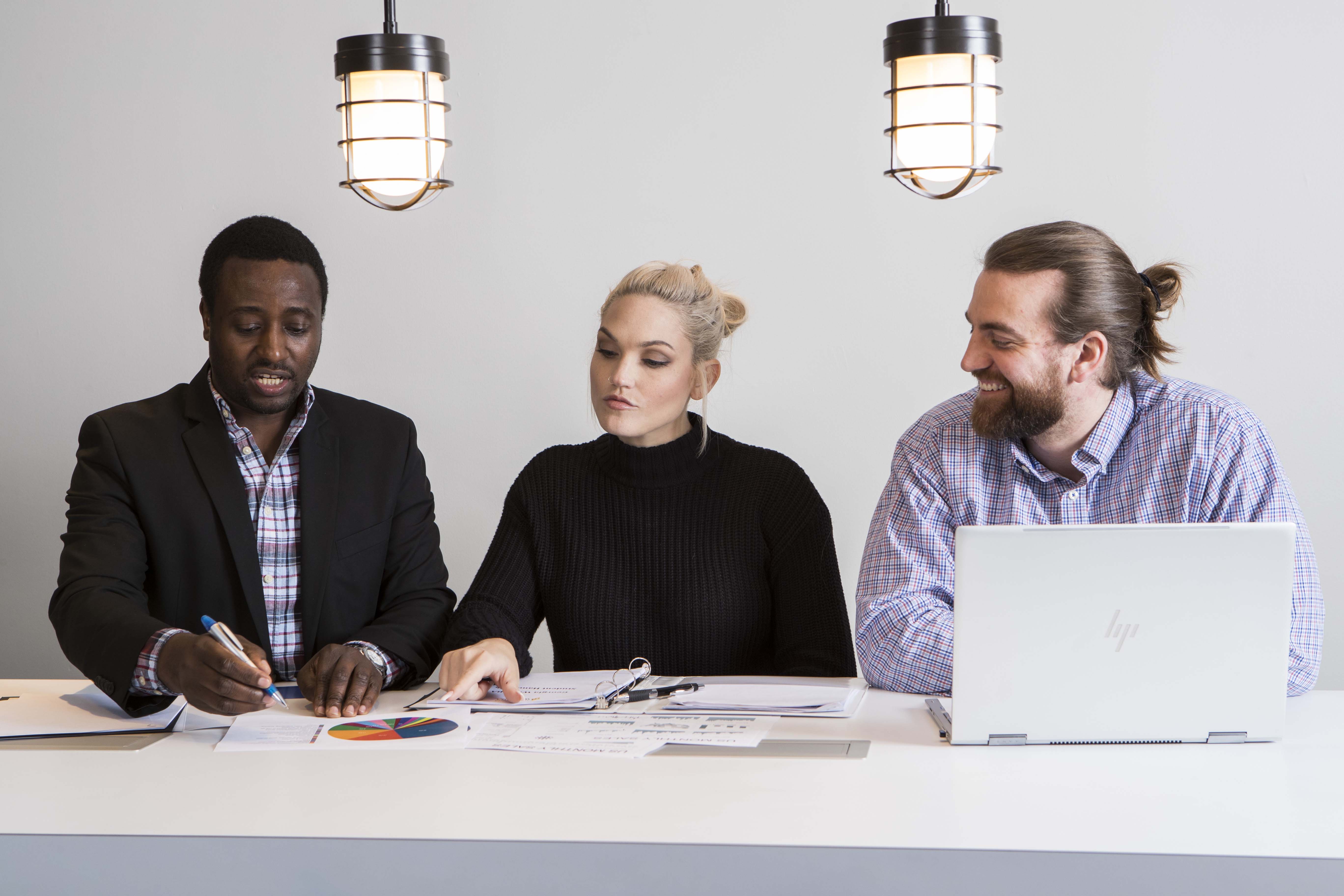 Three students discussing work