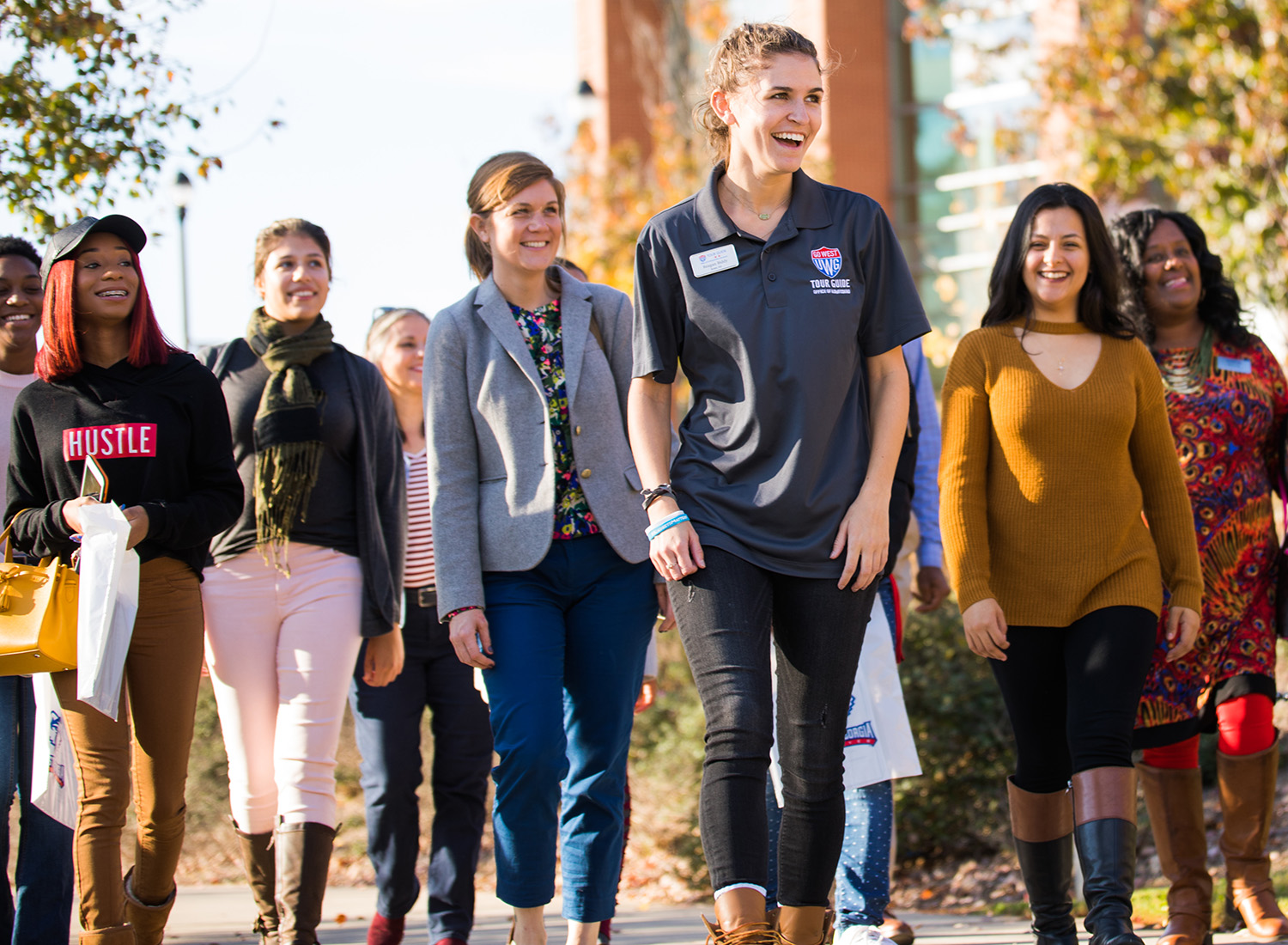 campus tour guide leading a group in front of the Campus Center