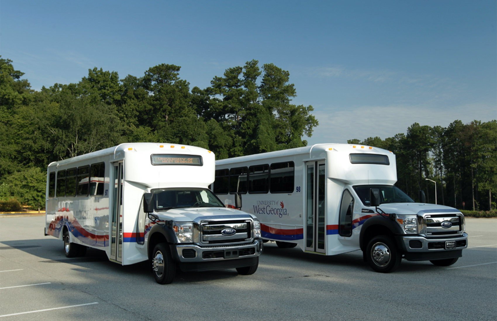 UWG buses parked on the street. 