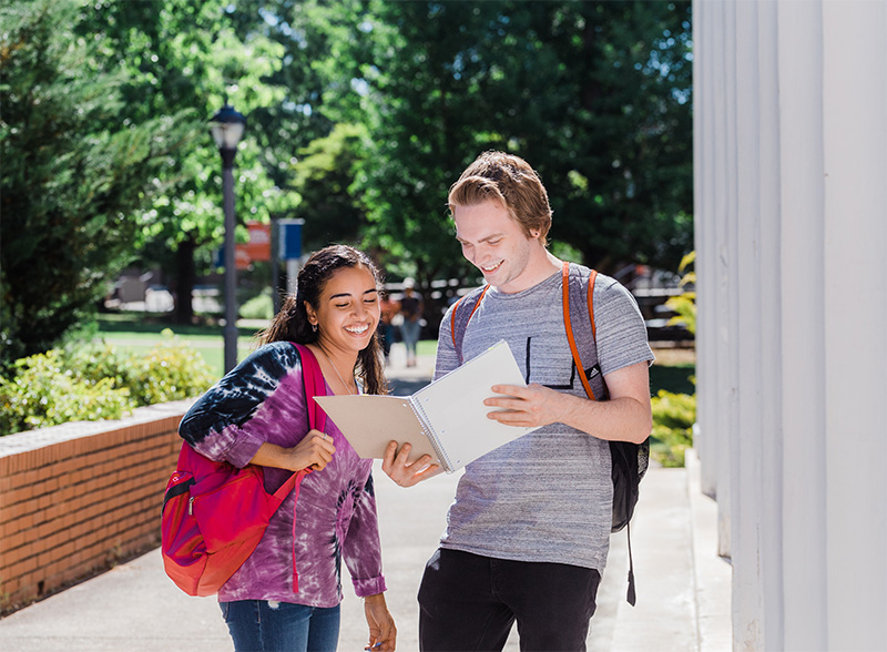 students talking outside