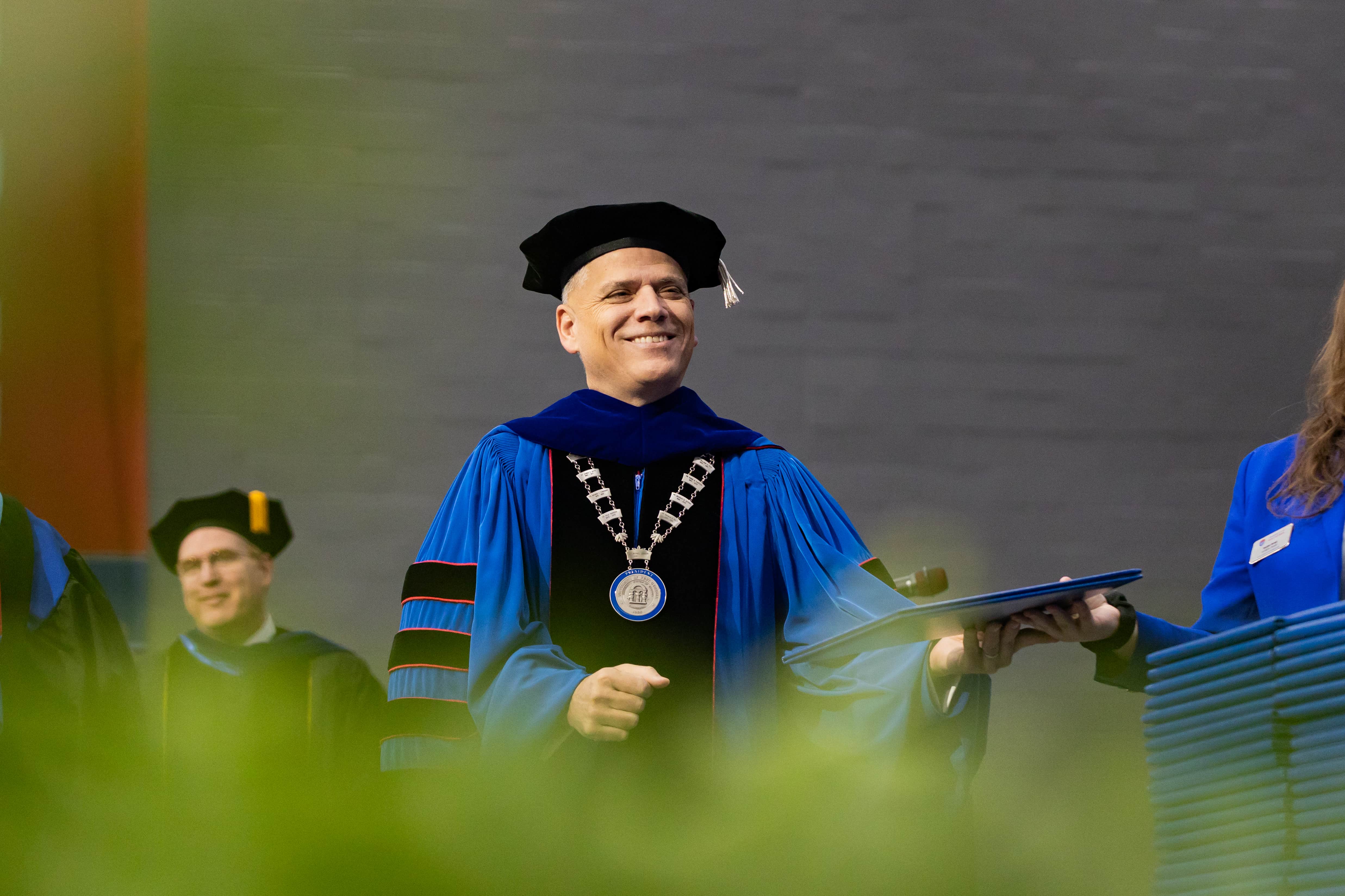 President Johnson wearing graduation regalia.