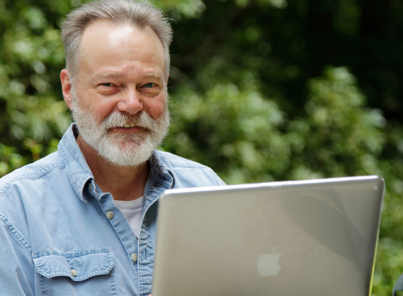 adult education student working on a laptop