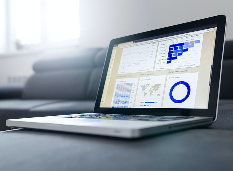 laptop displaying charts and graphs