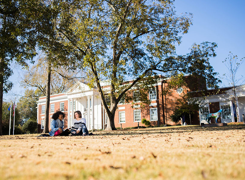 students sitting outside in front of UWG Newnan