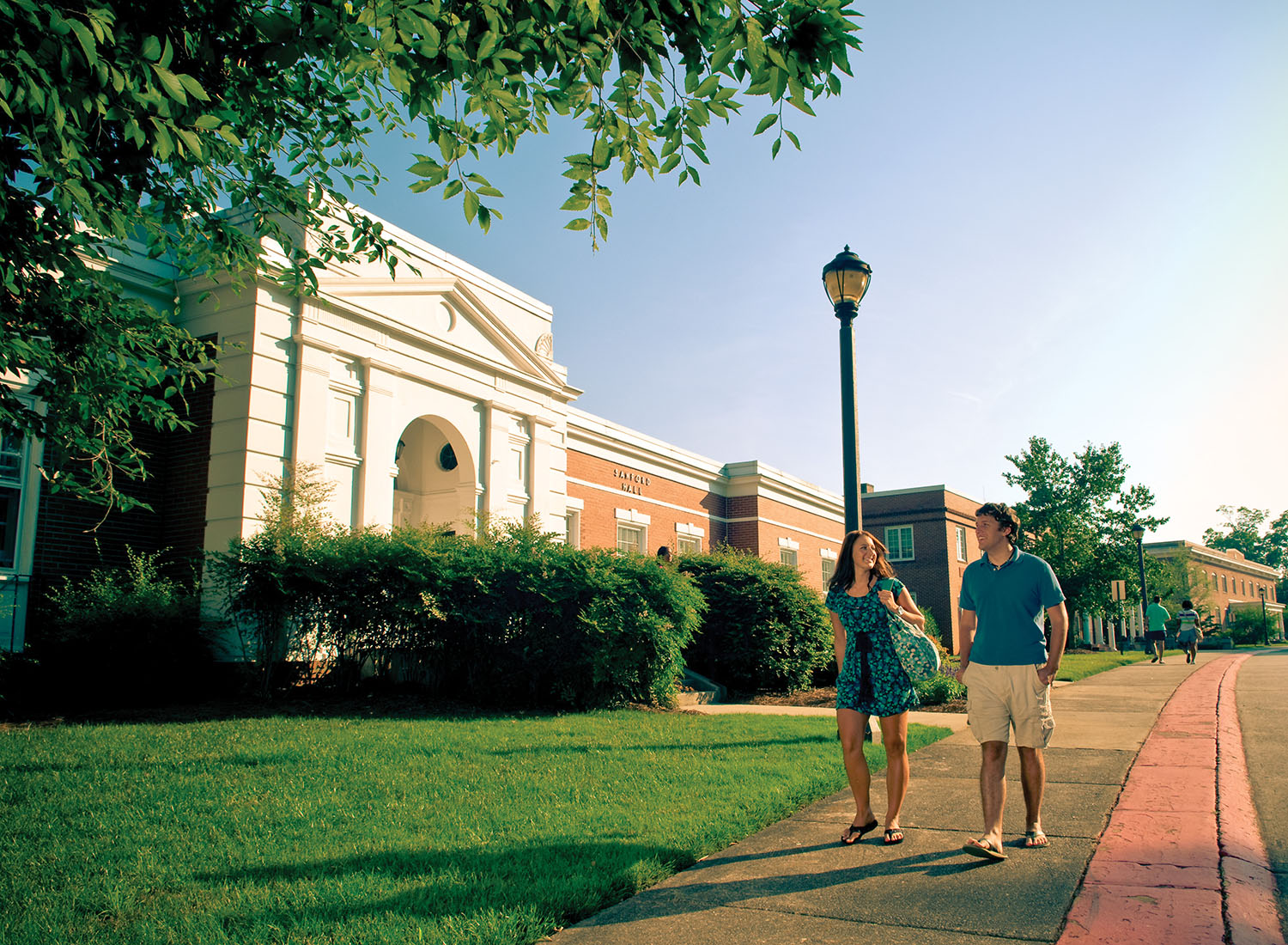 students walking in front of Sanford Hall