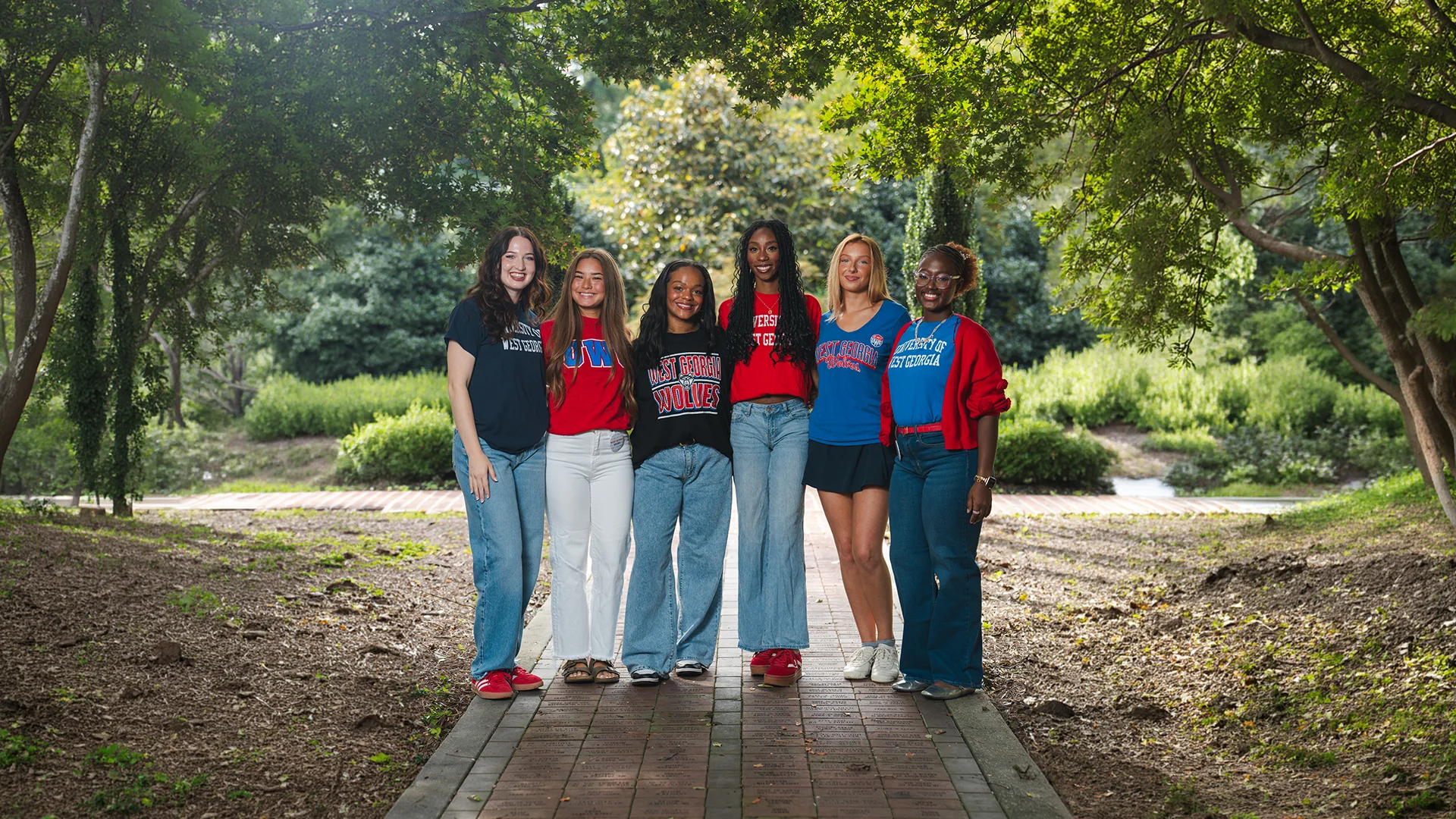 Fall 2026 Social Media Ambassadors group photo in the alumni courtyard.