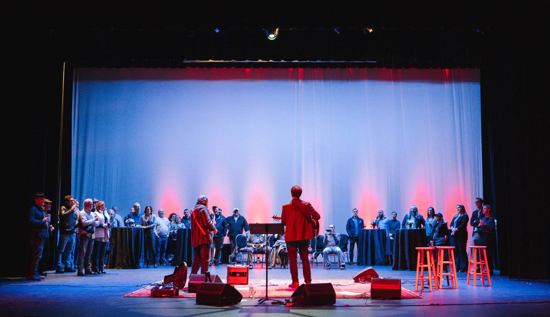 Mike Mattison and band performing for a backstage audience