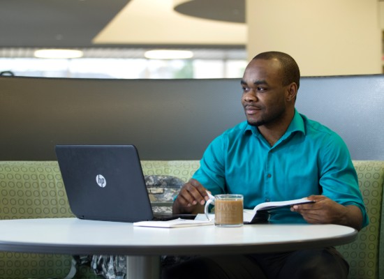 student working on a laptop in the Ingram Library