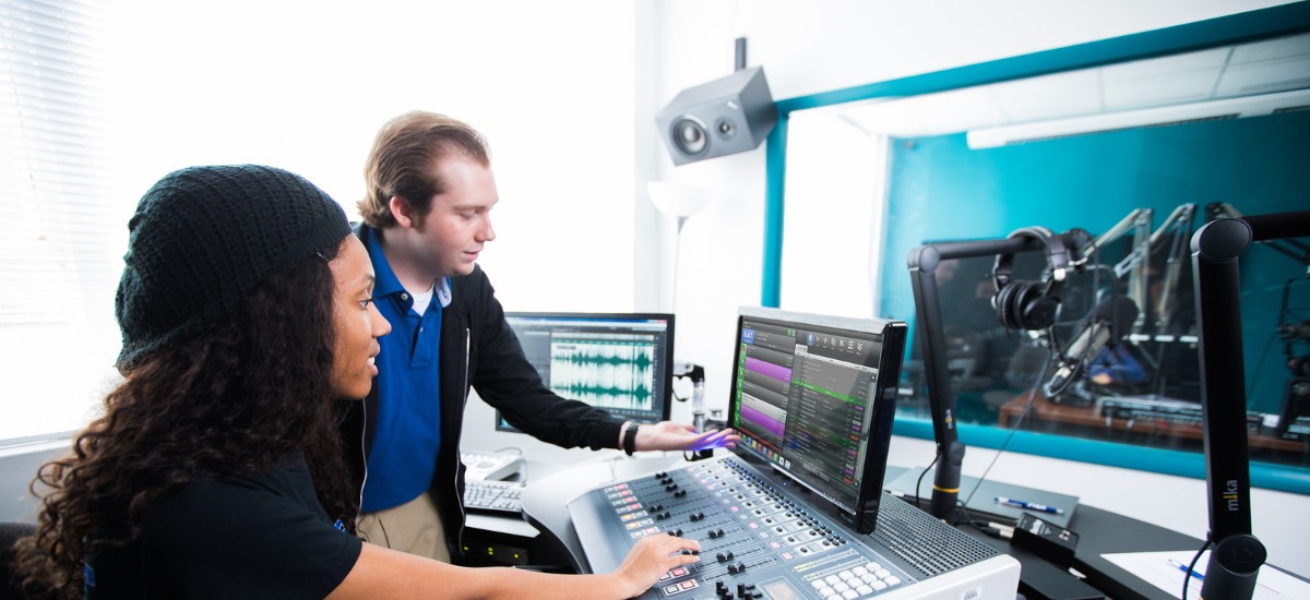 student and teacher on the radio