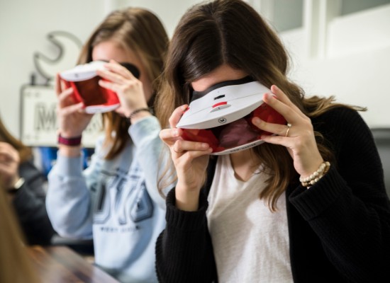 female students experimenting with virtual reality headsets