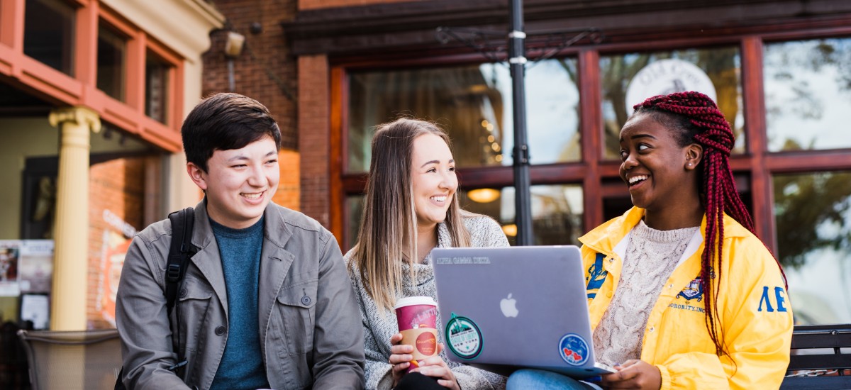 students working at laptop