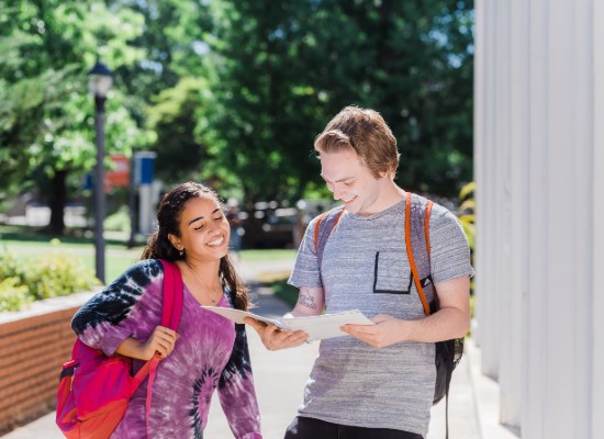 students talking outside