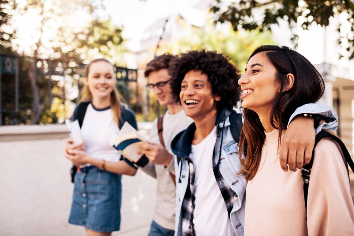 four students walking on campus