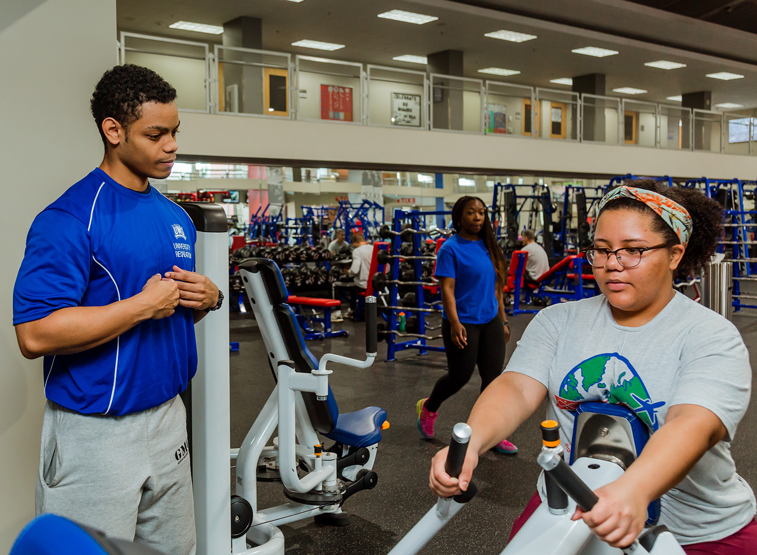 UREC personal trainer with a student