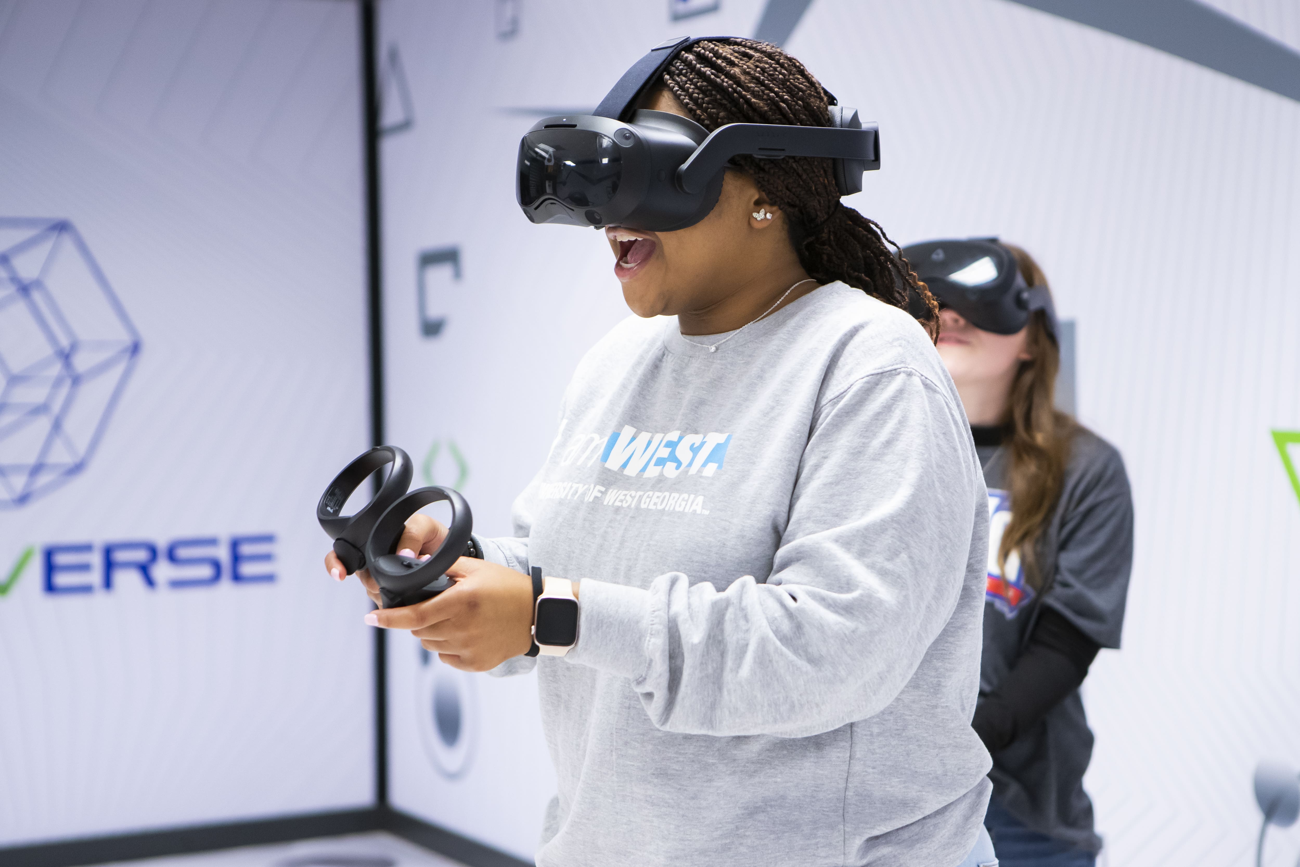 Social Media Ambassador, Jakai @uwg_eliteeight, playing with virtual reality headset and controller on..