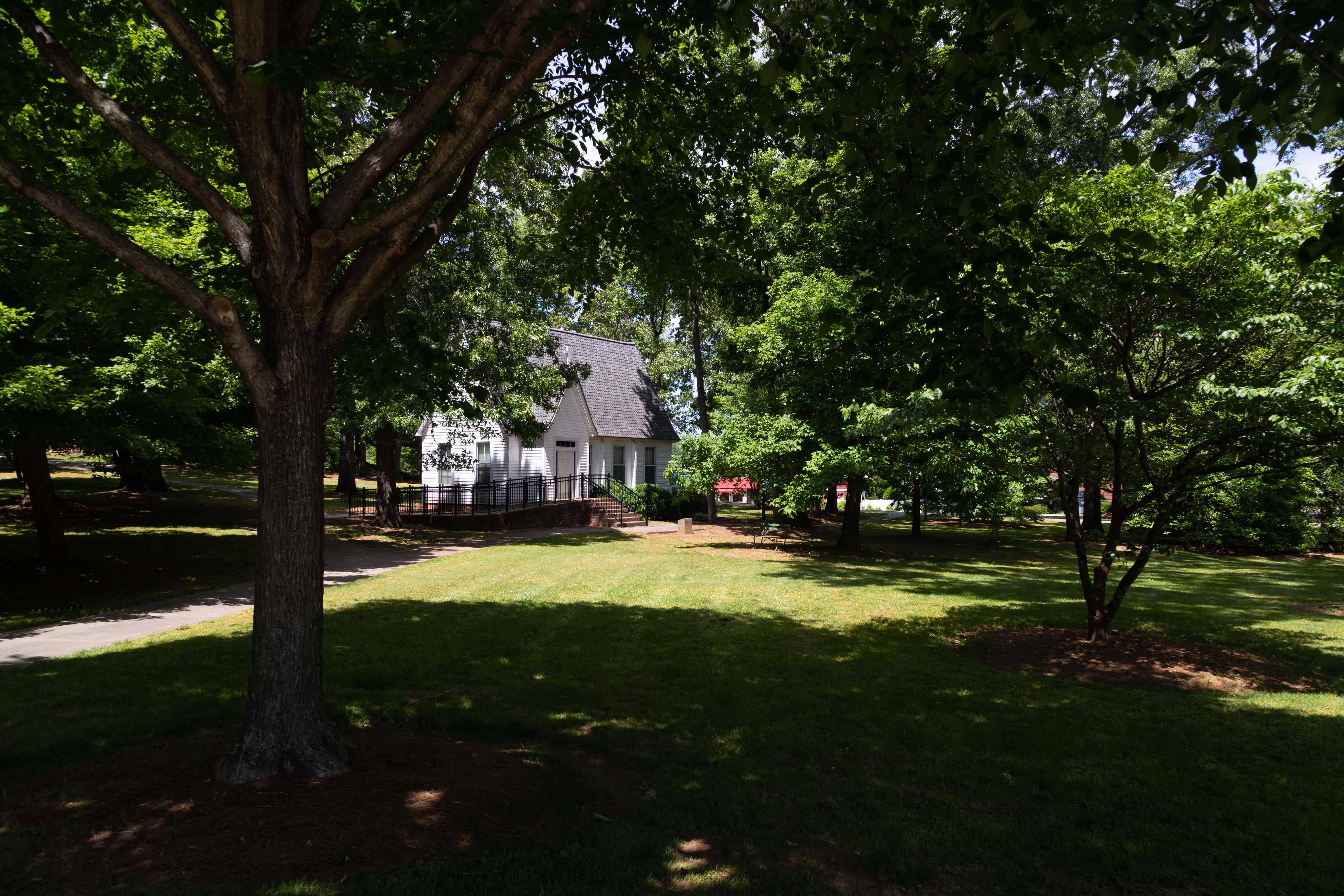 Small white church on front campus drive.