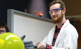 student at fair doing experiment