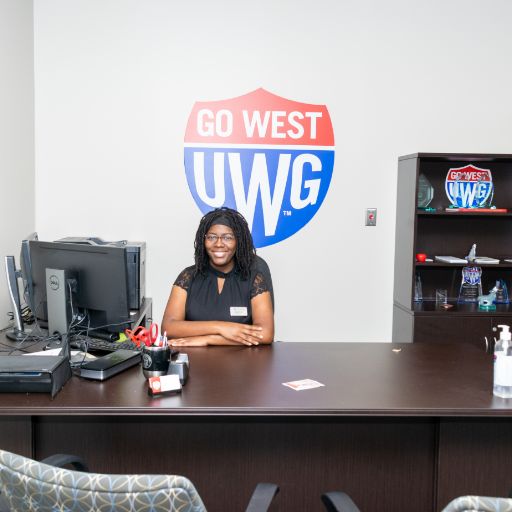 student behind office desk