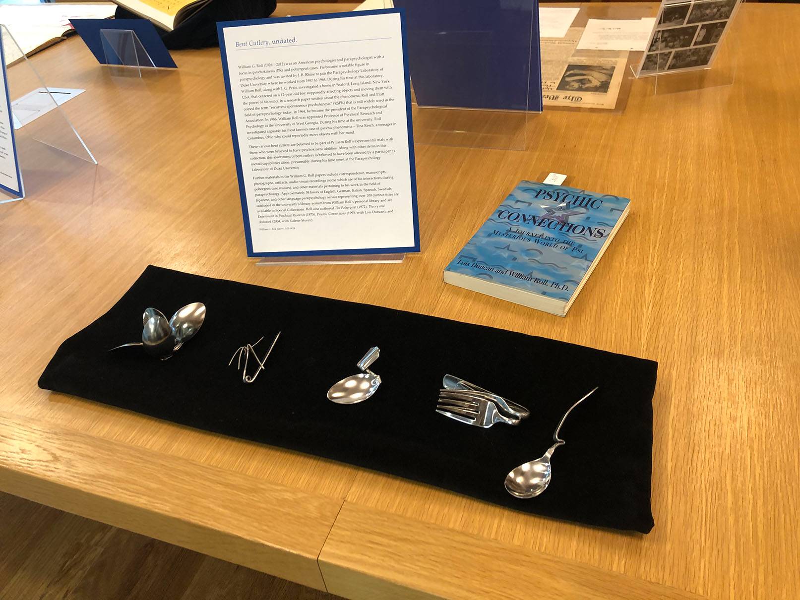Display of bent cutlery from the William G. Roll collection