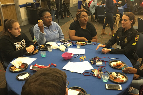 Sgt. Ashley Gossage talks with students.