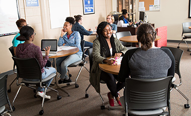 Students talking in an academic setting
