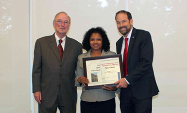 Chancellor Henry M. Huckaby and Georgia Historical Records Advisory Council (GHRAC) Chair P. Toby Graham presented the Center for Public History at the University of West Georgia and UWG alumna Tonya McNealey with awards during the 14th annual GHRAC Archives Awards ceremony at the Georgia Archives on Wednesday, Oct. 26. The GHRAC Awards recognize outstanding efforts in archives and records work in Georgia.