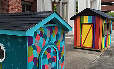 As part of a service project for literacy, University of West Georgia Ignite students have painted two playhouses that will be raffled this weekend to benefit the Carroll County Ferst Foundation for Childhood Literacy.