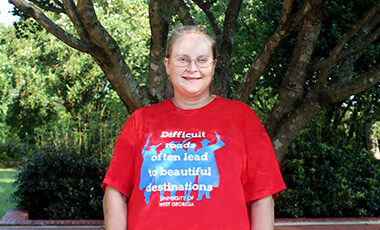A ladder with broken rungs. Walls looming above you. People standing at the top who say they can help. They hold out their arms to you, but you can’t reach. That’s the image University of West Georgia student Jeri Shaffer uses to illustrate the trap of poverty.