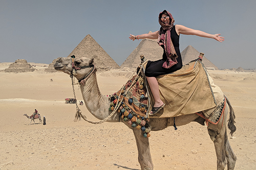 Taylor Enfinger riding a camel