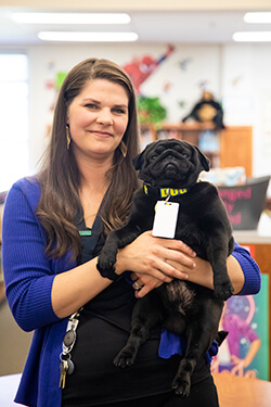 Meghen Bassel holds Booker T. Pug