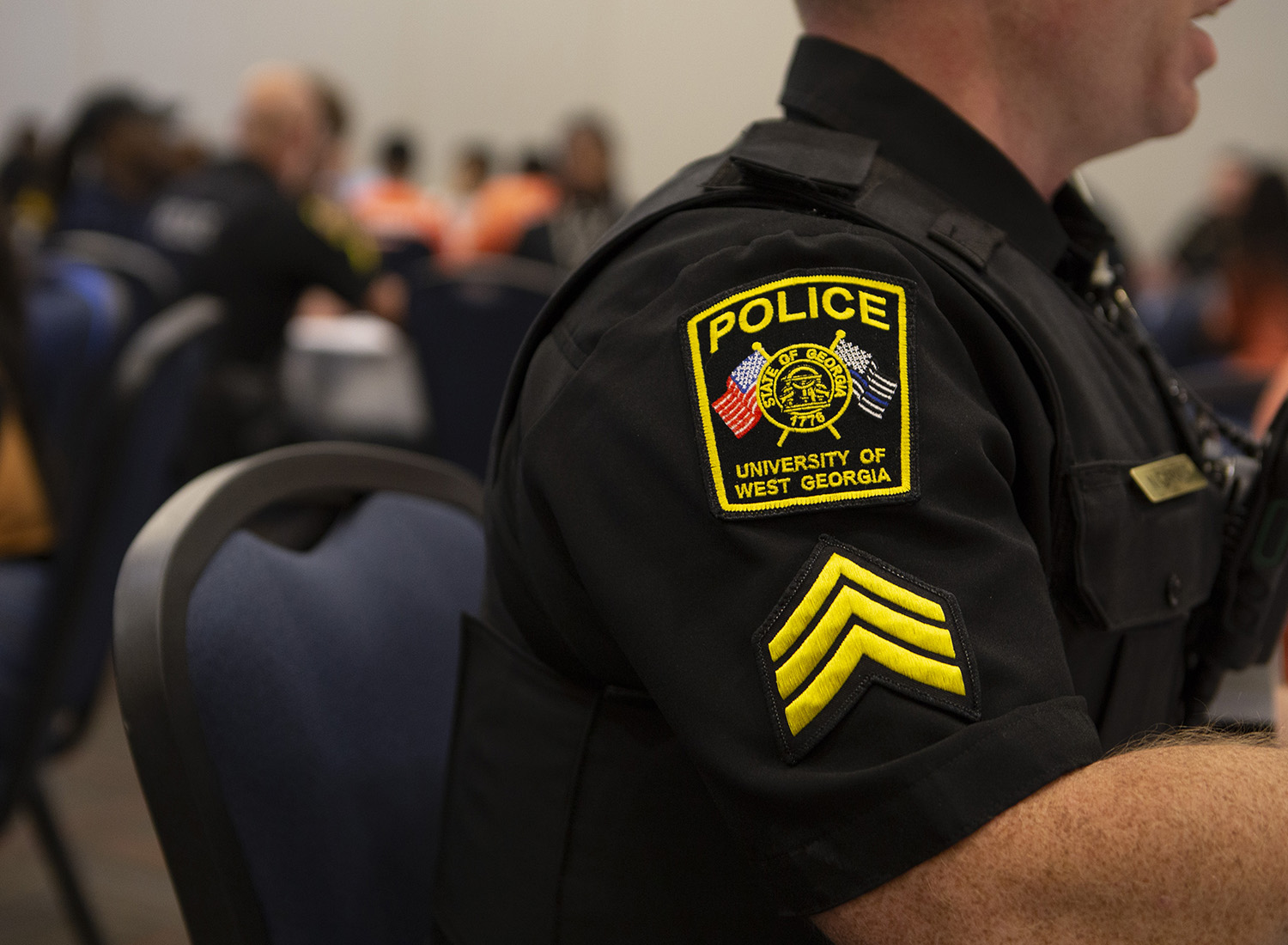 Side view of university police officers badge.